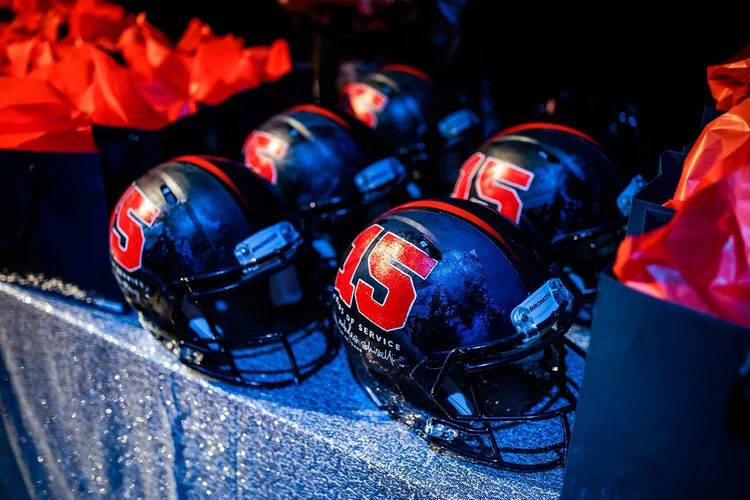Denver Broncos Honors awards helmets with 15 years of service text backstage Mission Ballroom