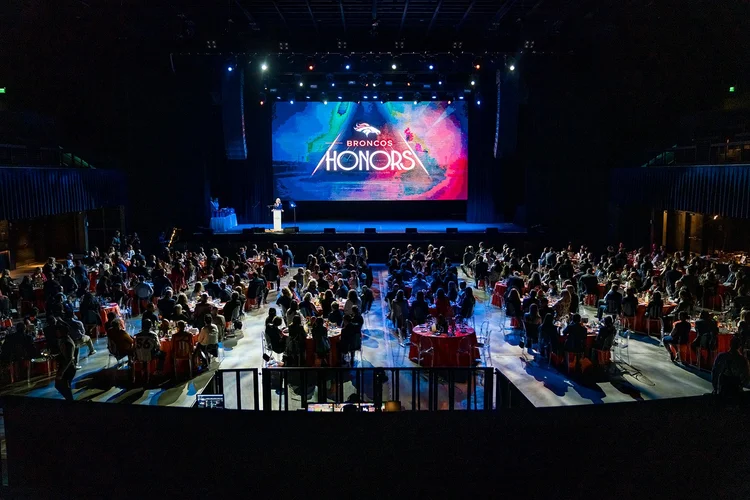 Full room aerial view of Denver Broncos Honors Awards program at Mission Ballroom Denver Colorado