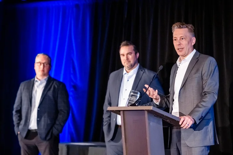 Candid networking moment at corporate event Englewood Colorado photographer