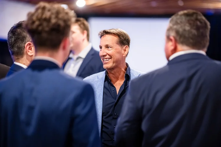 Candid conversation at corporate event photography Englewood Colorado