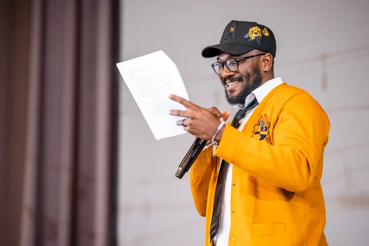MC with microphone at Meet the Greeks event Tivoli Turnhalle MSU Denver Auraria Campus