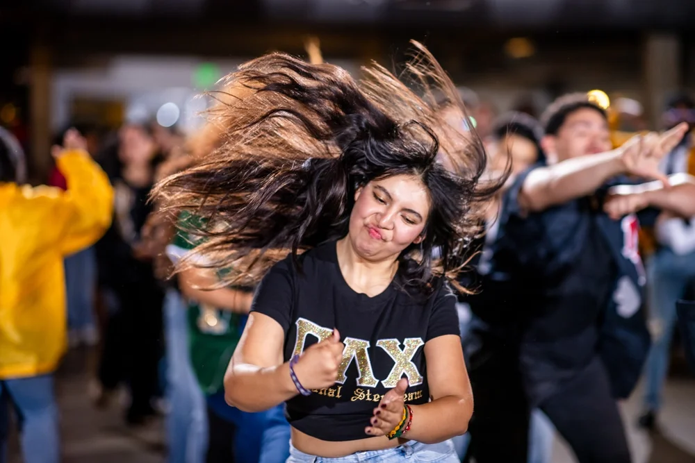 Pi Alpha Chi step team member performing at Meet the Greeks Tivoli Turnhalle MSU Denver
