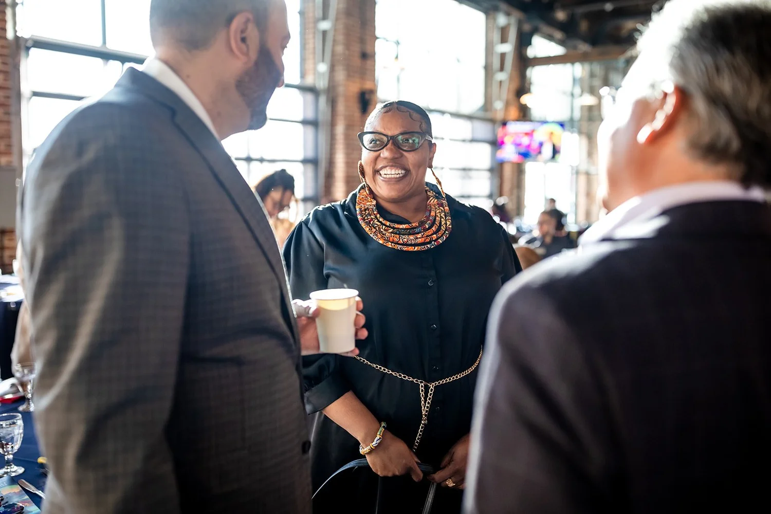 Guest laughing and networking at MSU Denver MLK Peace Breakfast Mile High Station Denver Colorado