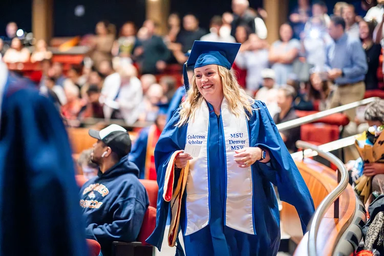 Full room view of MSU Denver MSW ceremony graduates applauding inside Ellie Caulkins Opera House Denver
