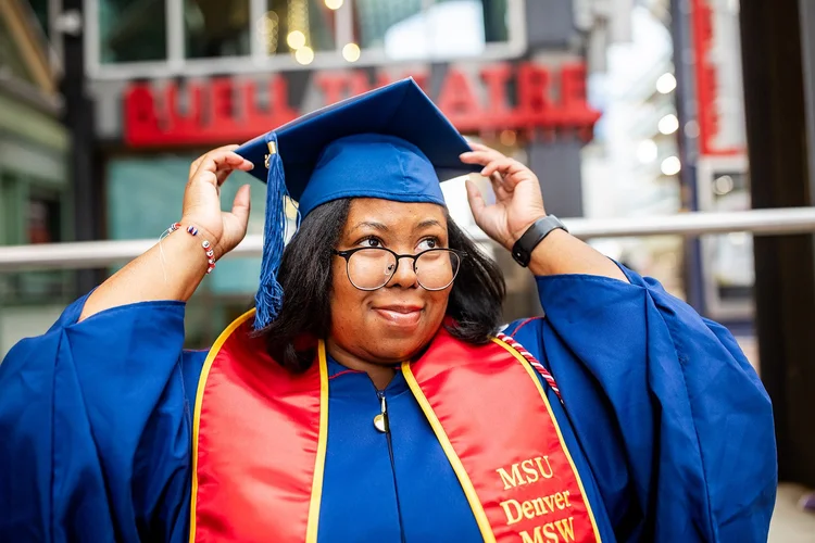 MSU Denver MSW Class of 2025 cohort and faculty group photo on DPAC atrium staircase Denver Colorado