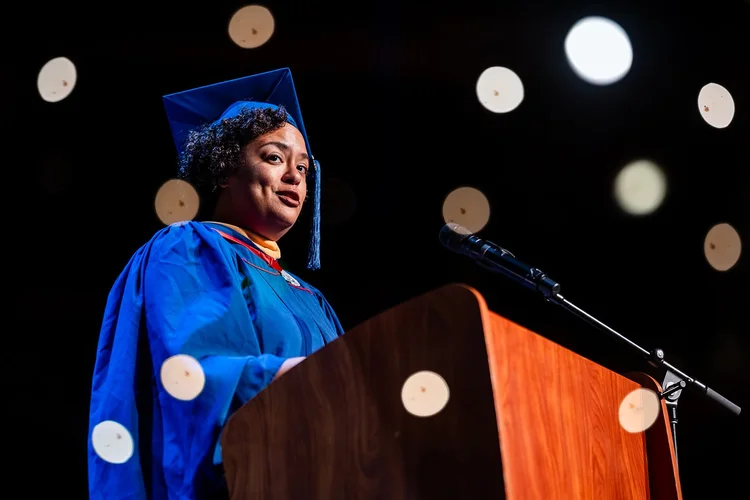 MSU Denver MSW CoAccess Scholar graduate being hooded on stage Ellie Caulkins Opera House Denver