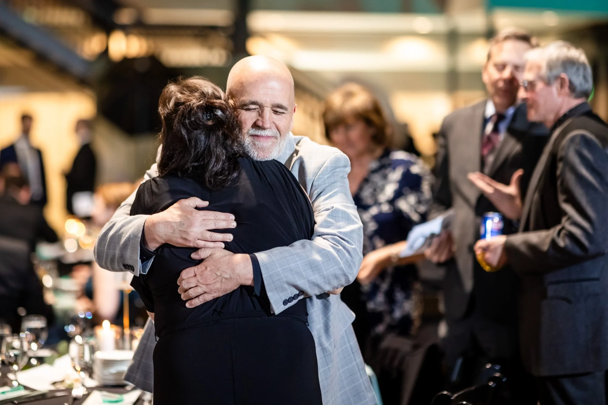 candid emotional moment at nonprofit gala event photography Denver Colorado
